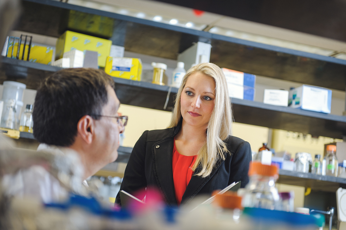 Biomedical Sciences Major speaks with a professor about best practices